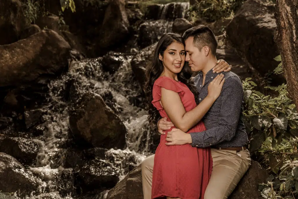 Smiling Embracing Couple in the Forest