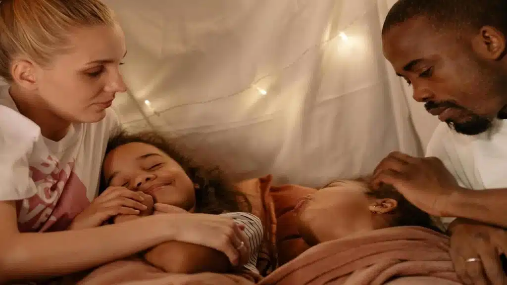 A couple looking at their daughters