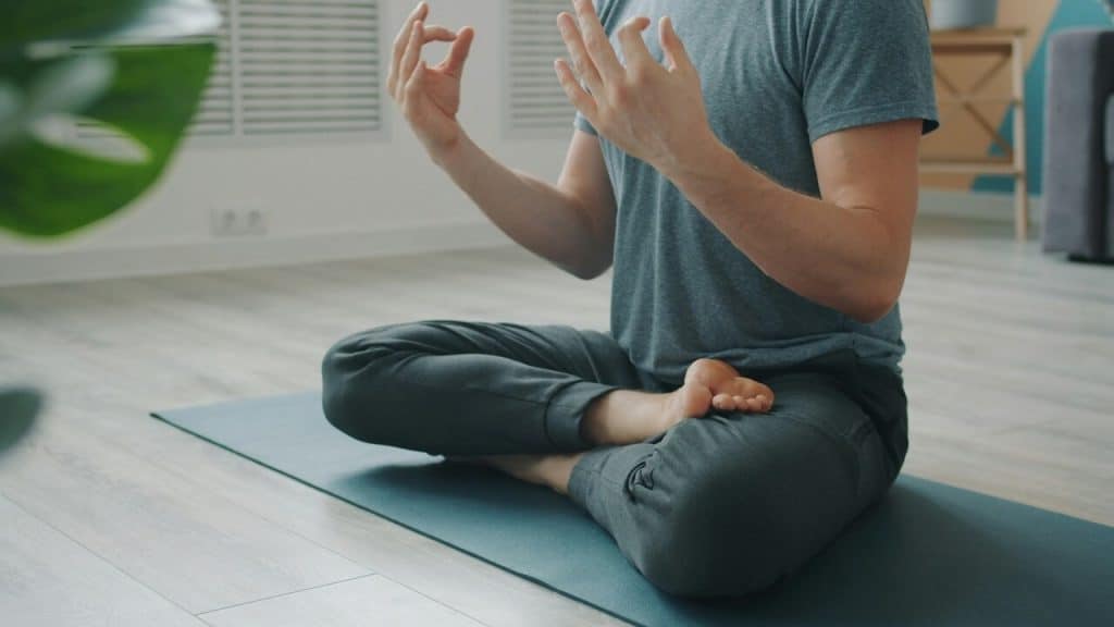 A man doing yoga at home