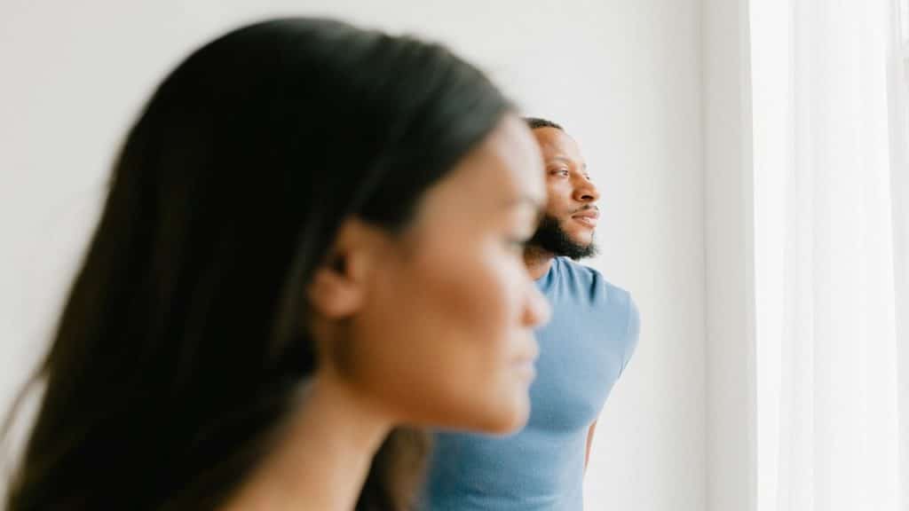 A man and a woman not looking at each other