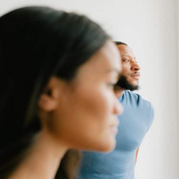 A man and a woman not looking at each other