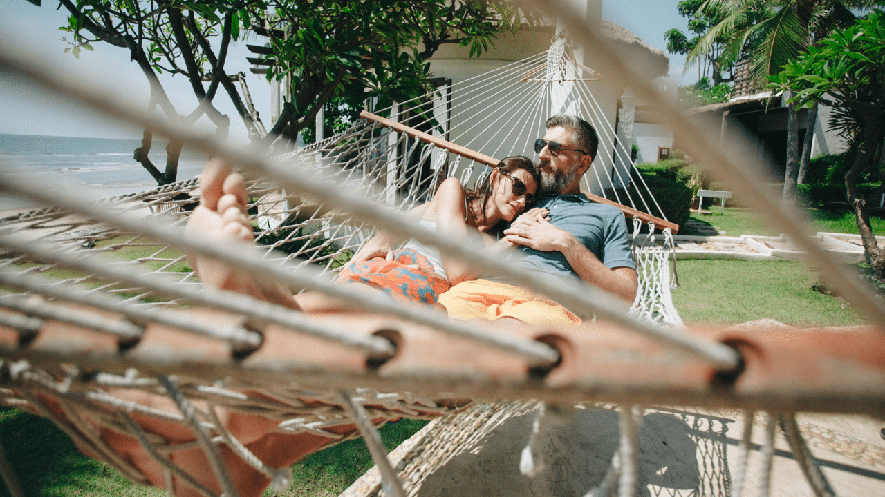 A couple relaxing on a hammock