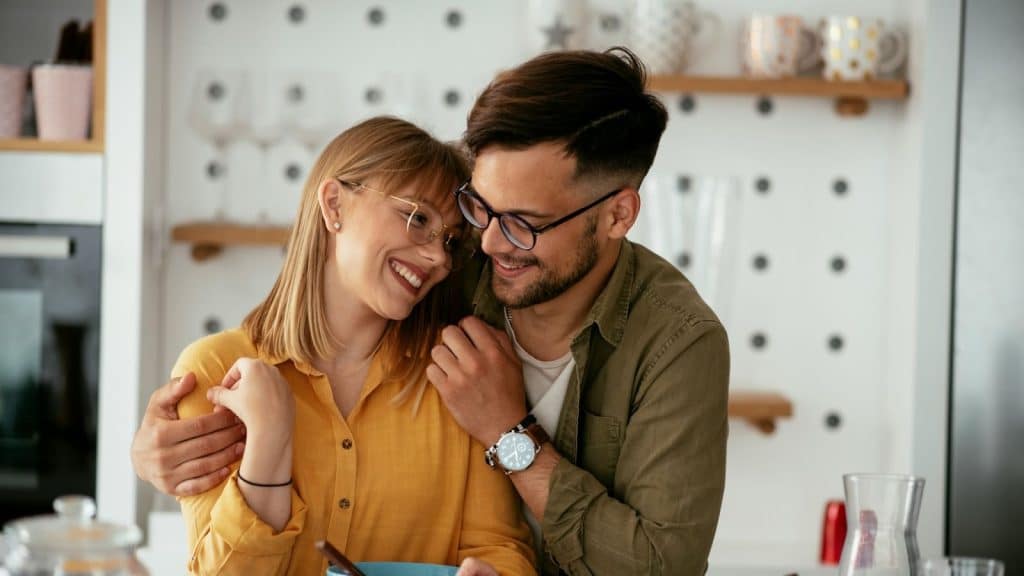 A man hugging a woman