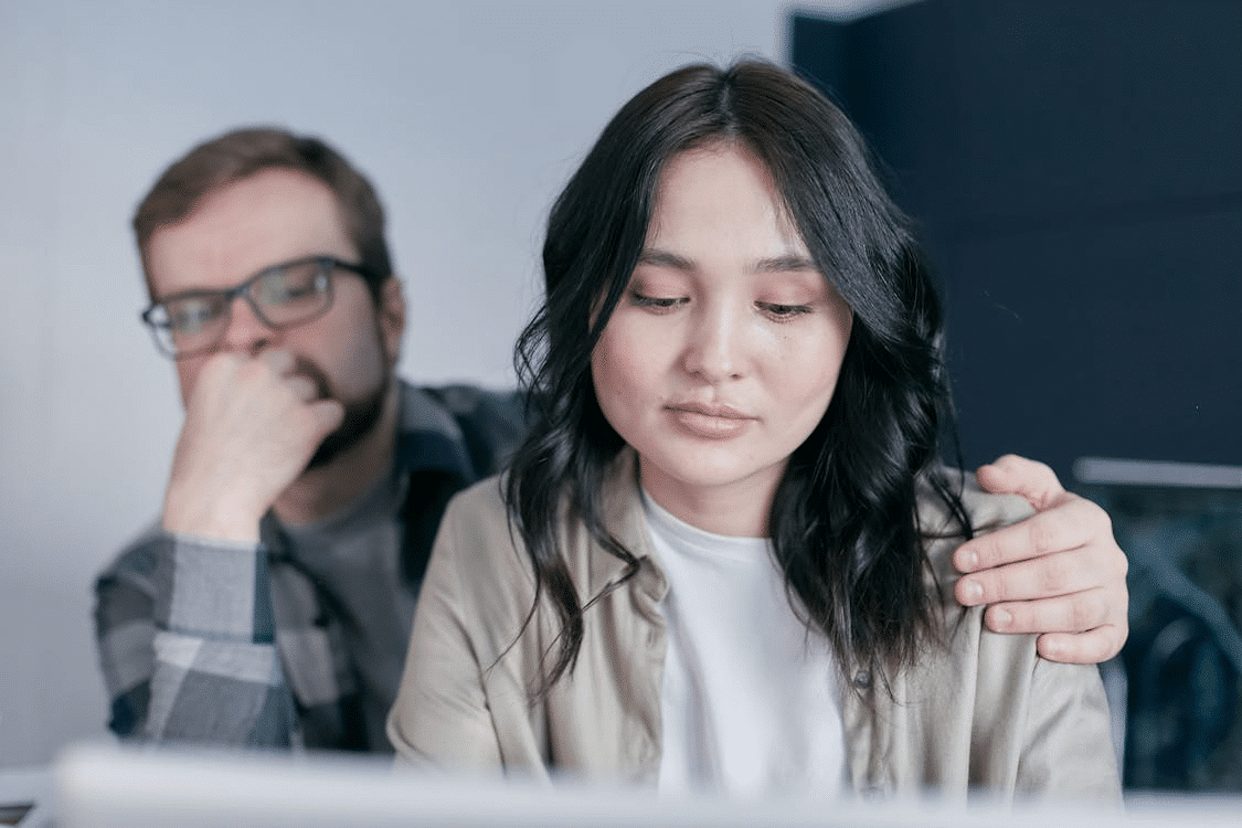 A Man Holding a Woman on her Shoulder