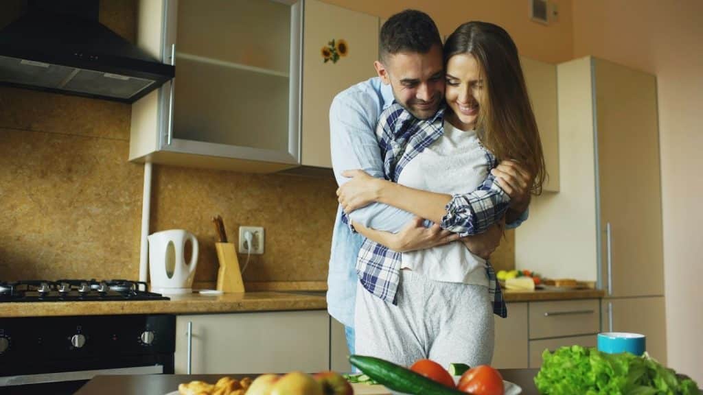 A man hugging a woman