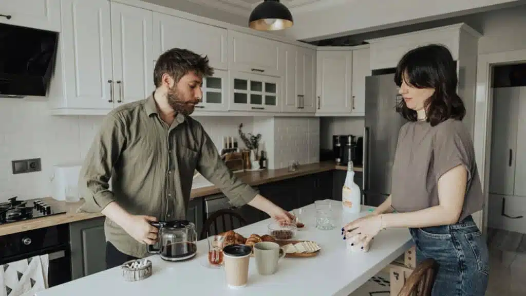 A man and woman at the kitchen