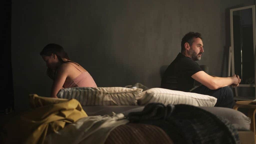A man and woman turning their back from each other