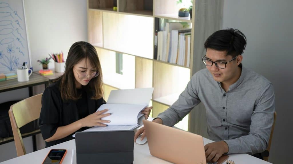 Man and woman working late together 