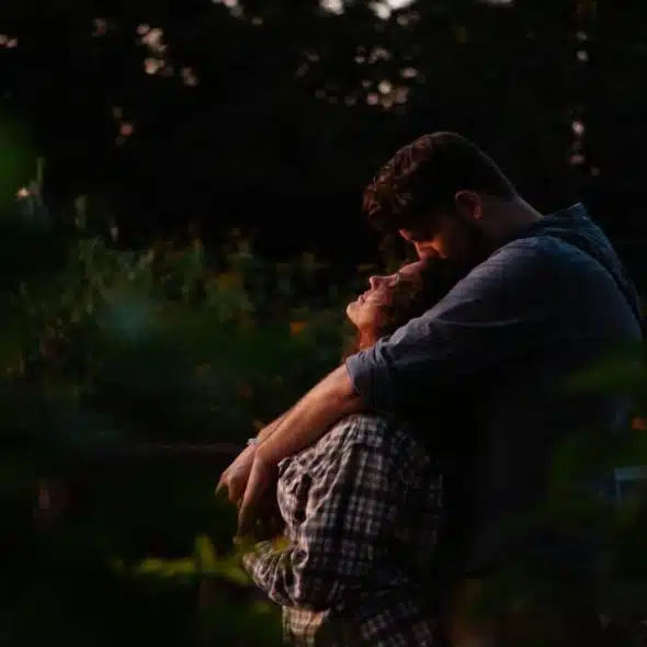 A couple hugging during sunset