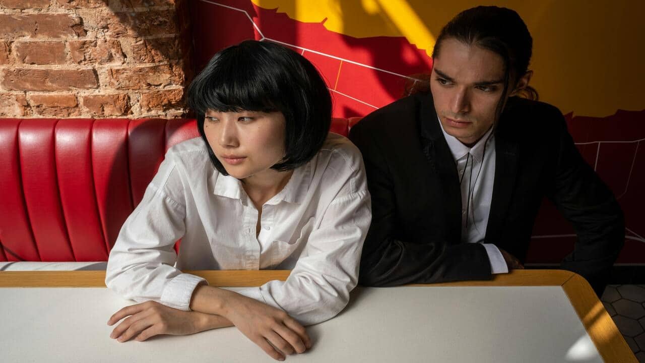 A couple looking serious at a restaurant