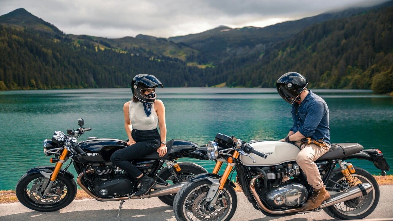 A couple riding motorcycles together