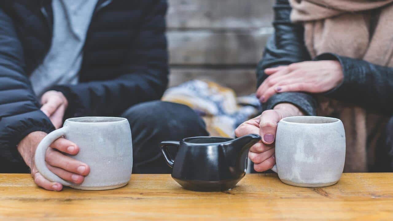 Two people having coffee