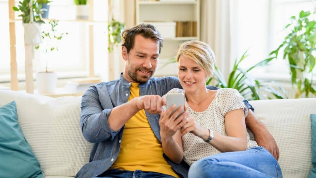 A man and woman at the couch