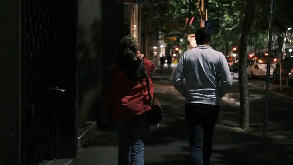 A man and a woman walking