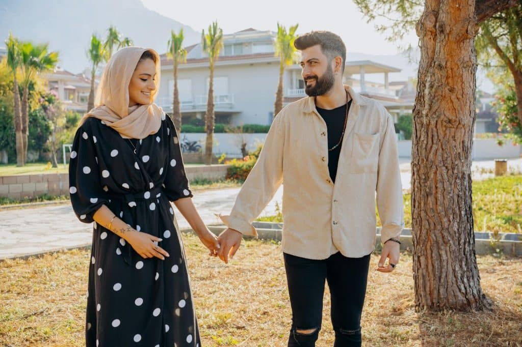 A man and woman holding hands
