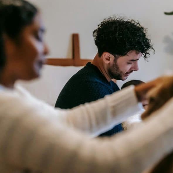 A man and woman being silent while doing house chores