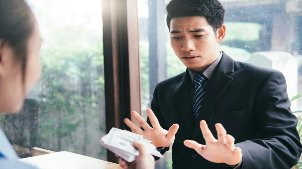 A man refusing a bribe