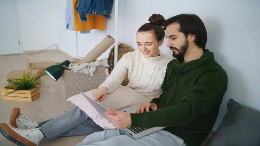 A couple looking at something on their laptop 
