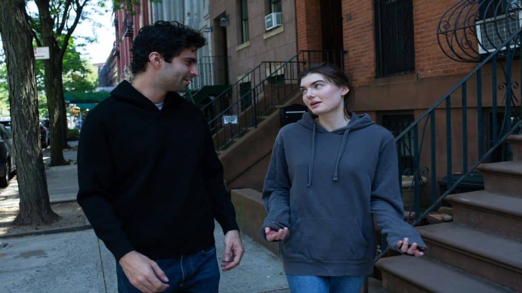 A couple walking on the sidewalk