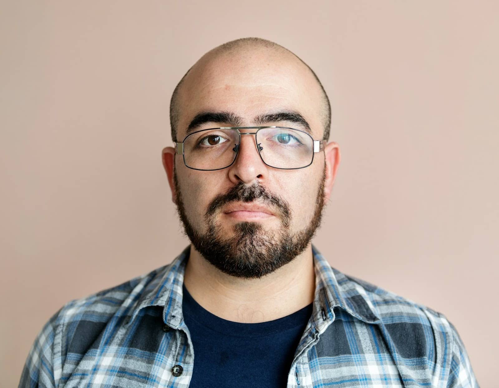 man neutral face indoors