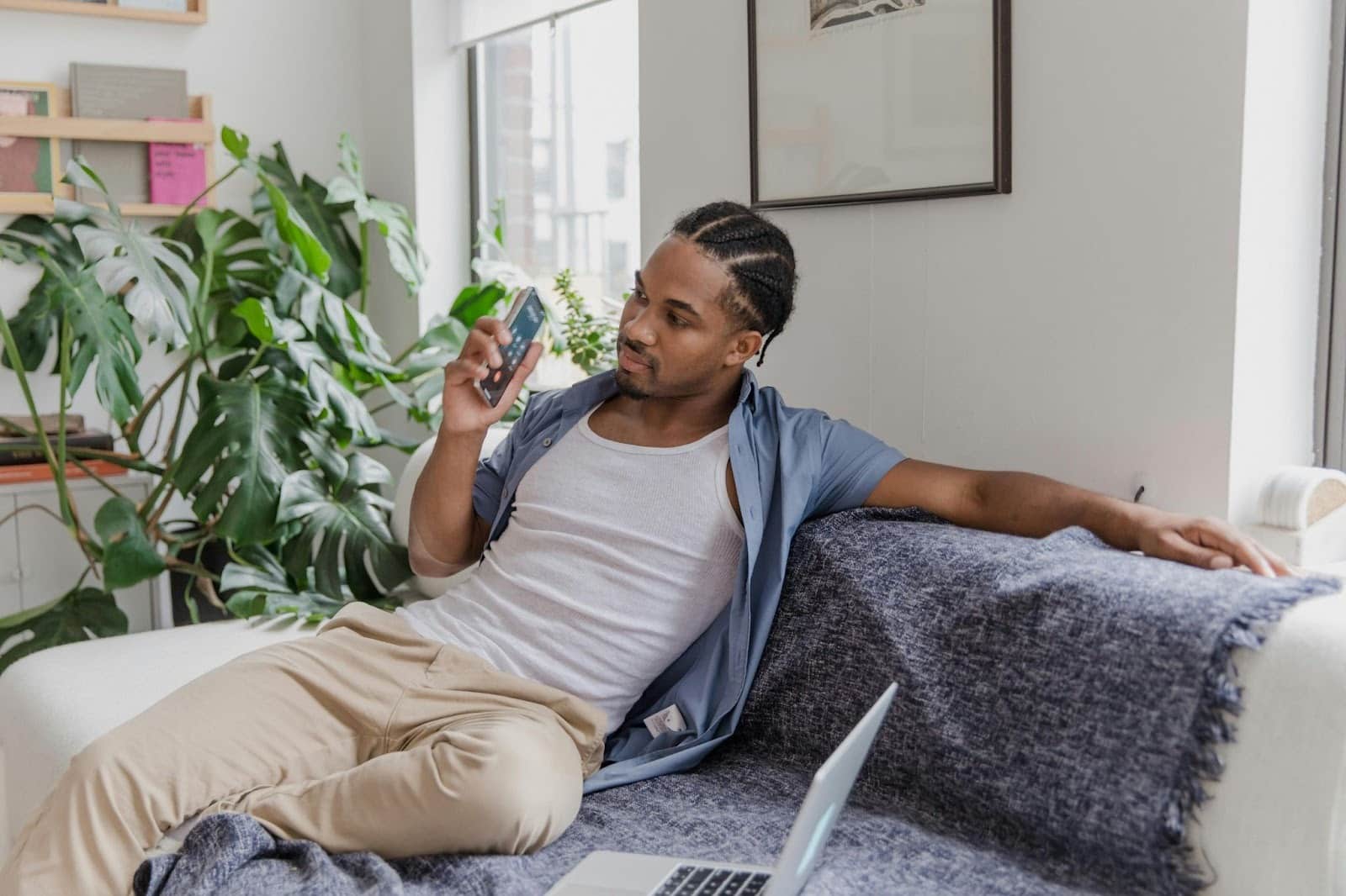 A man sitting alone at the sofa