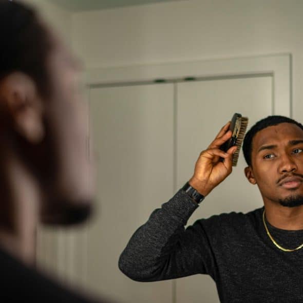 A man styling his hair