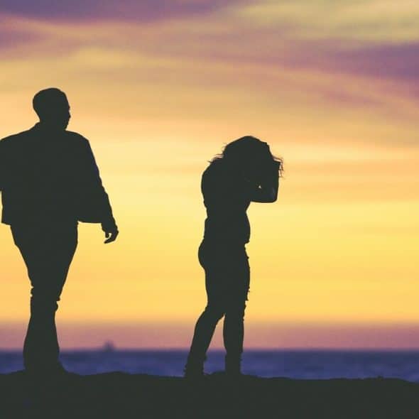A couple fighting at dusk