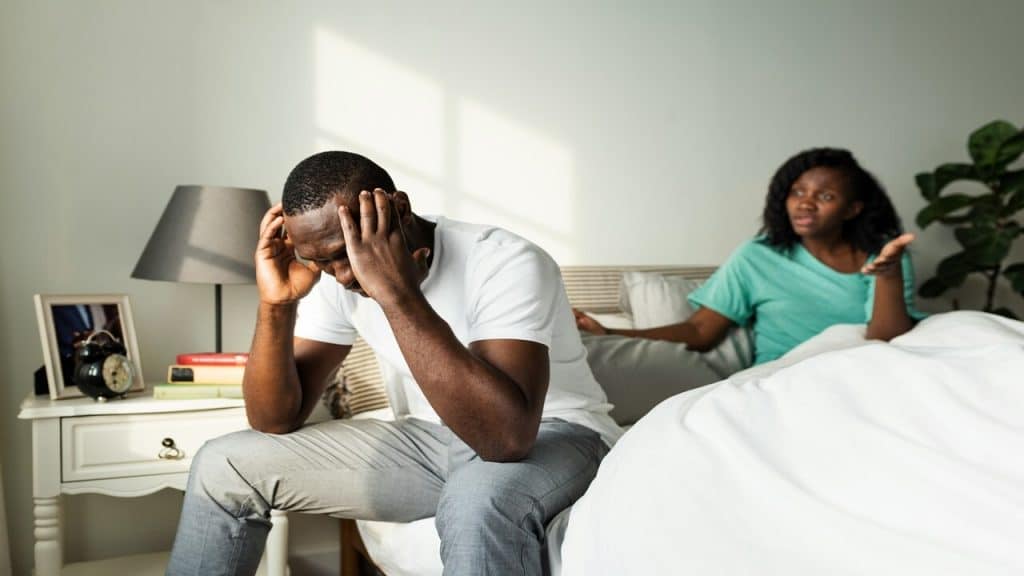 A man turning away from his wife