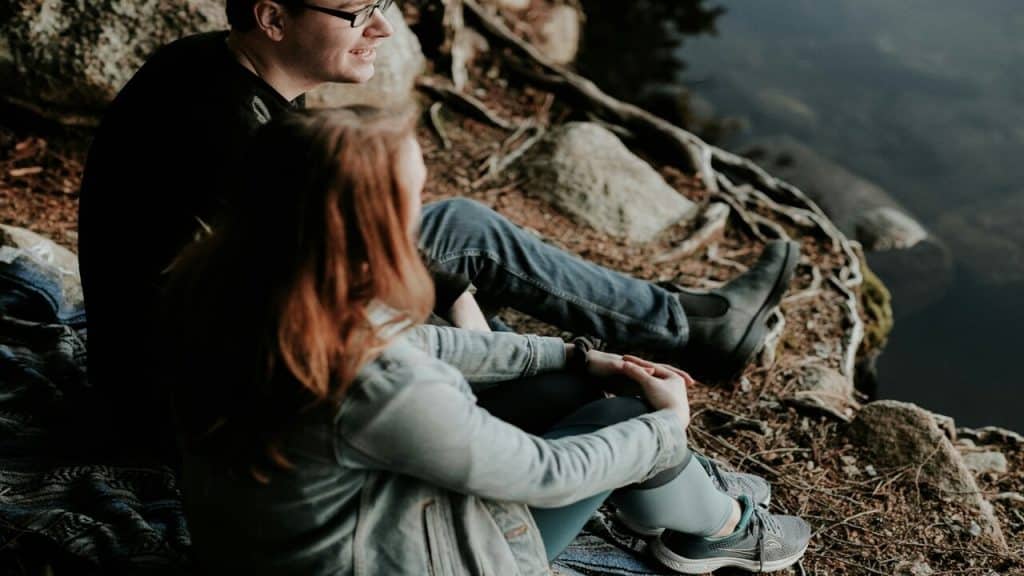 A couple on a date by the lake