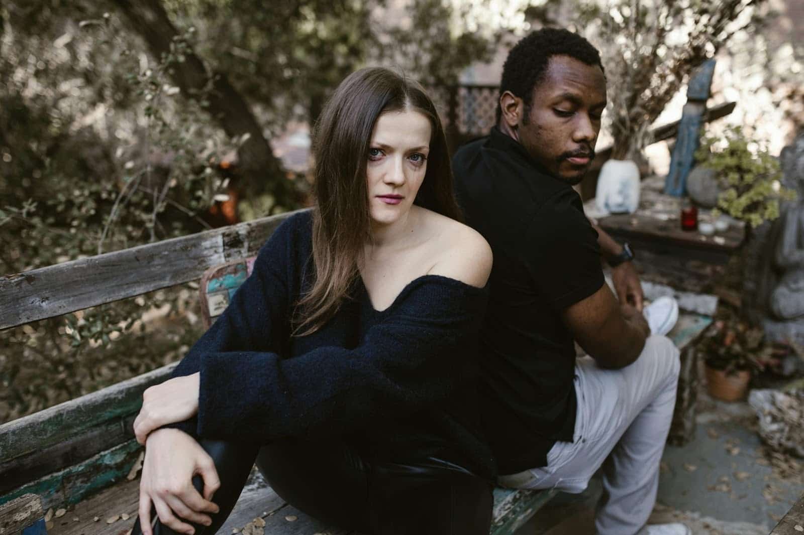 A man and woman at the wooden chair