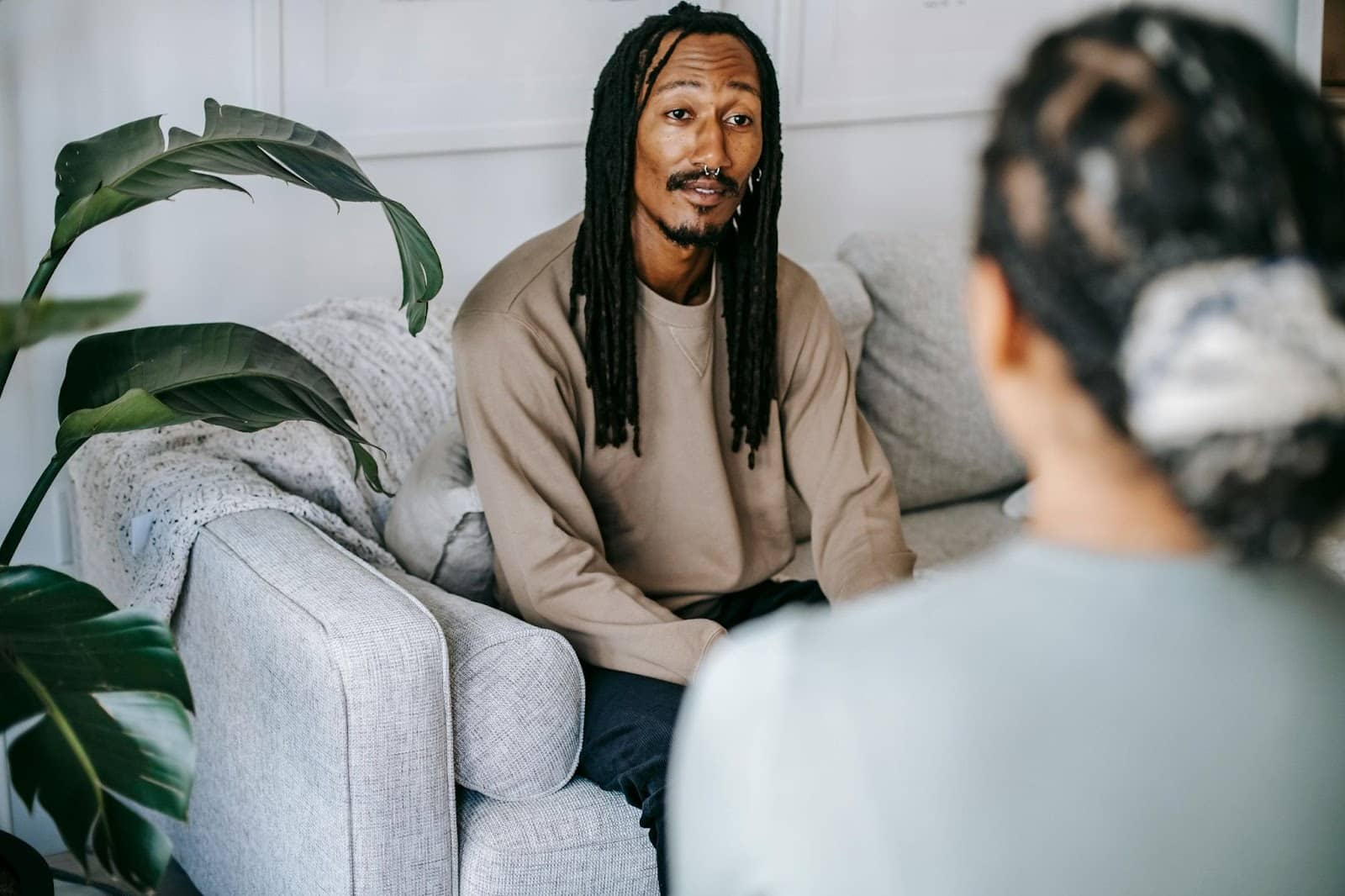 A woman talking to a man