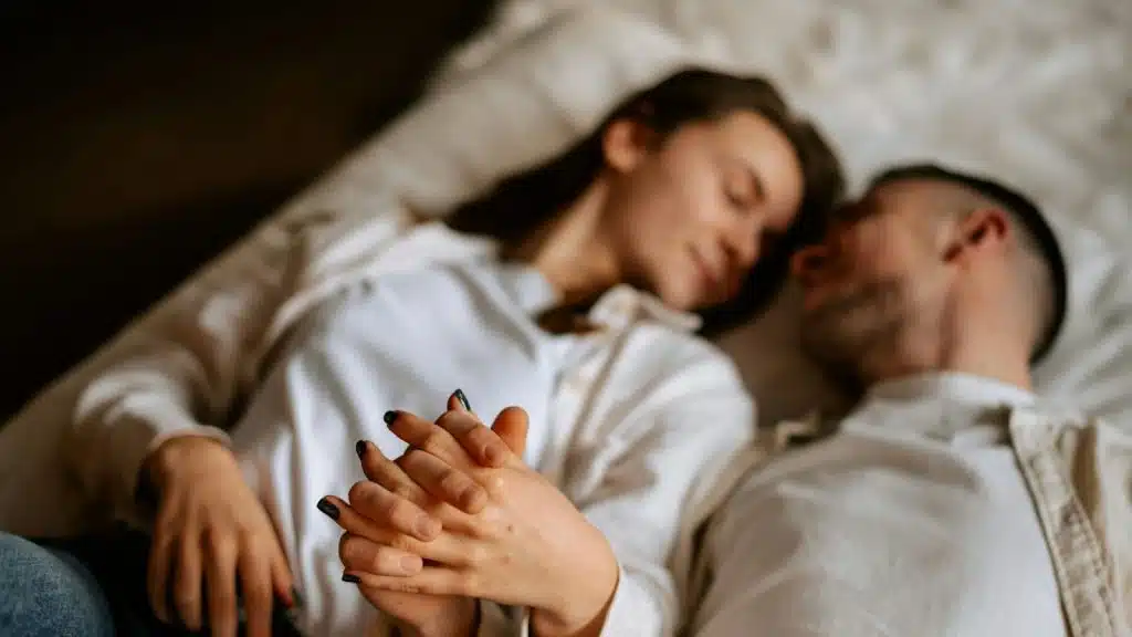A man and woman holding hands