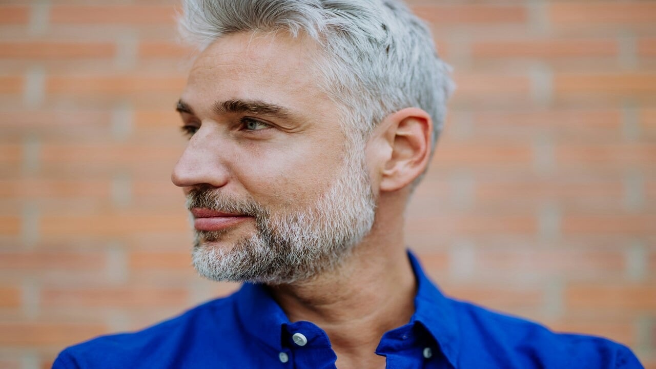 A mature man looking away