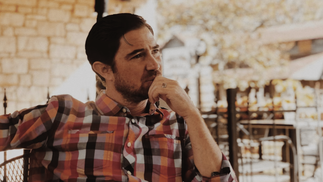 A man thinking at a restaurant
