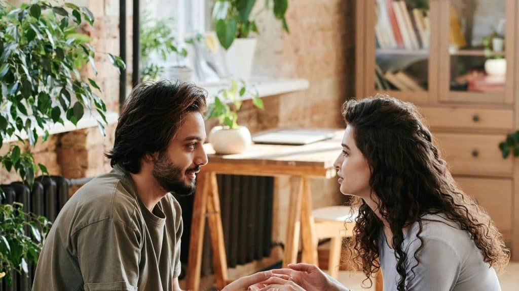 A man and woman sitting at a restaurant table