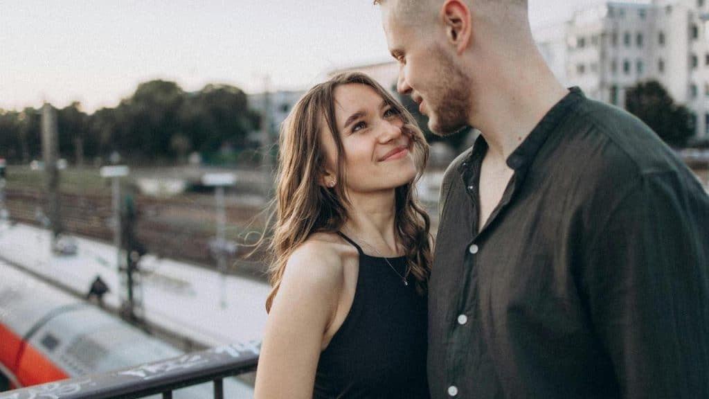 A couple smiling at each other