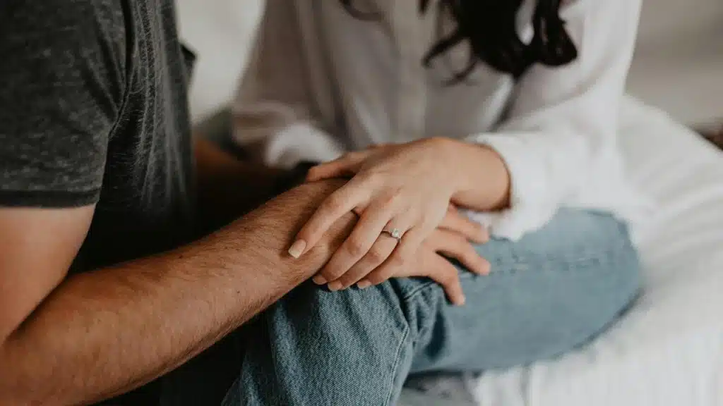 A couple holding each other
