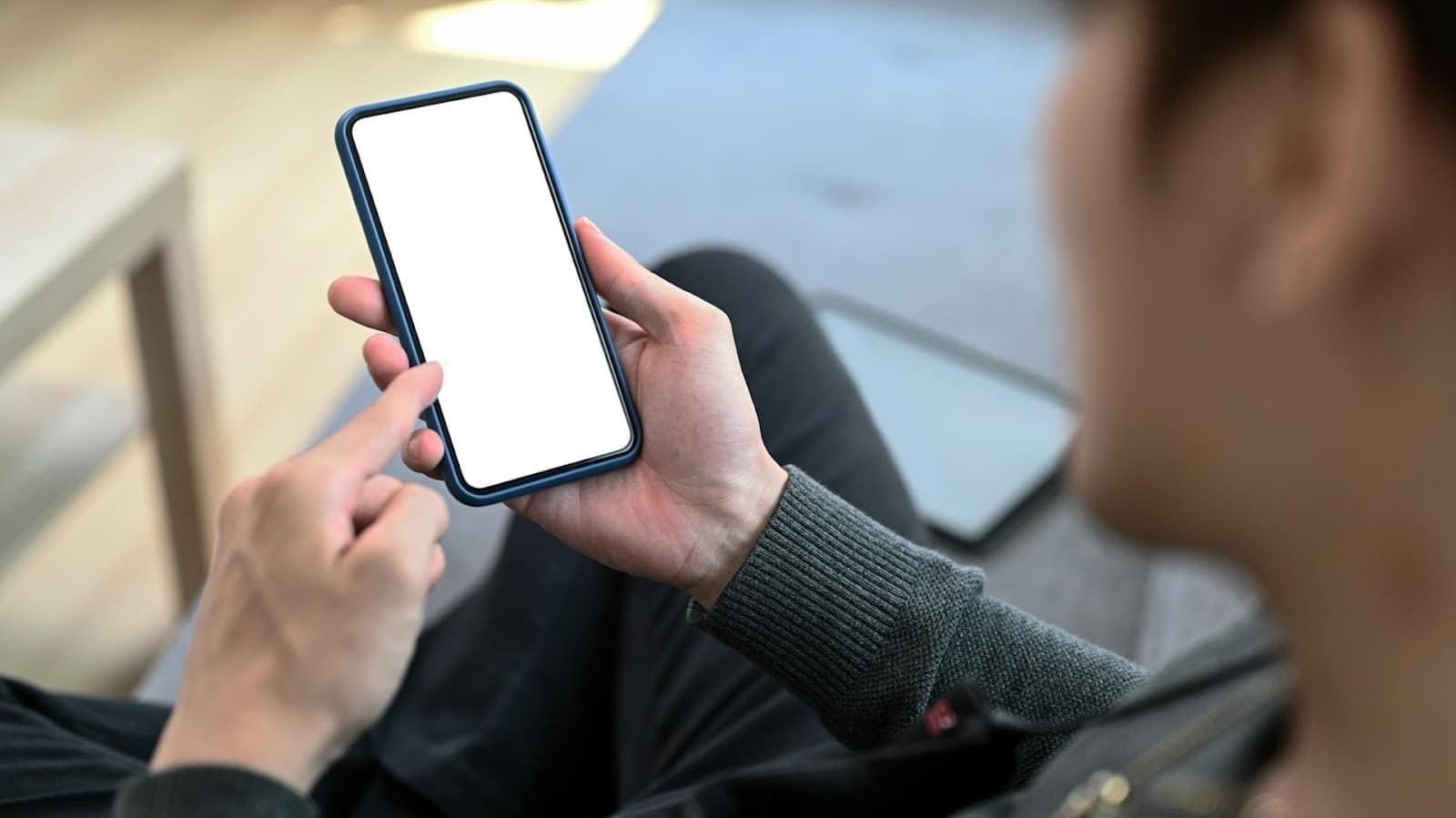 man scrolling phone