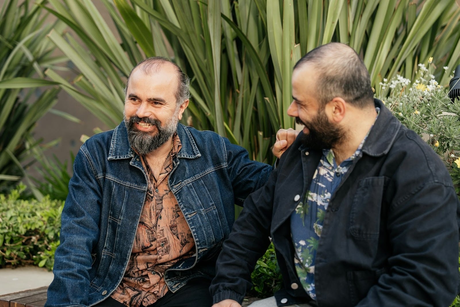 men talking outdoors