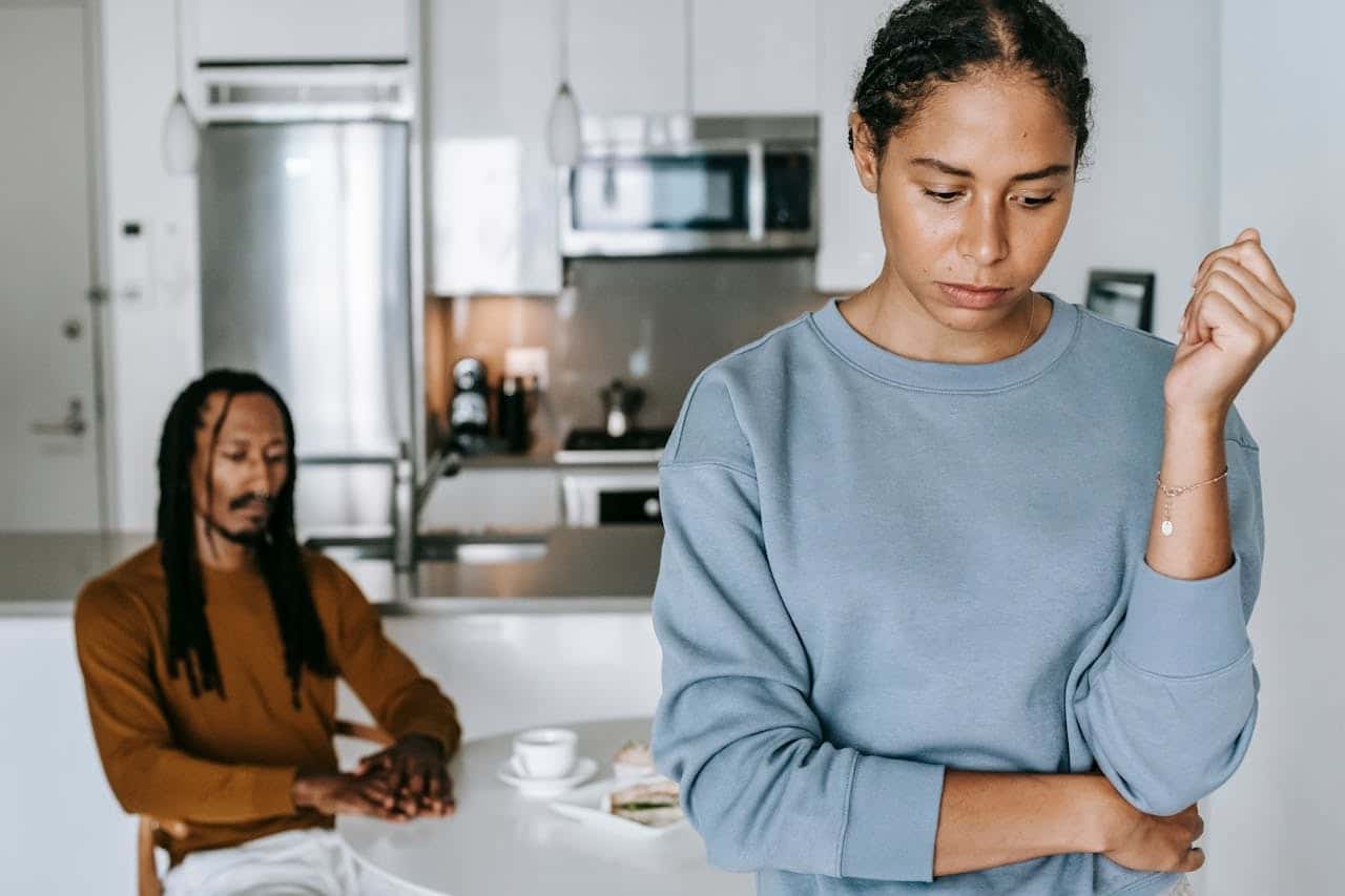 stressed couple kitchen table