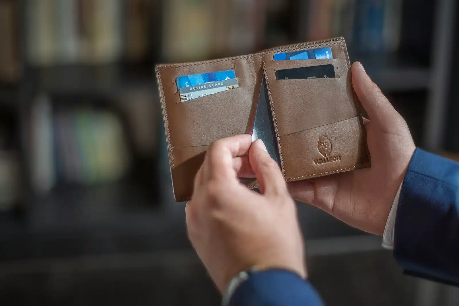 person hiding credit card