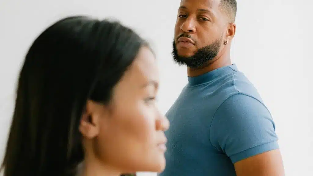 A man and a woman standing next to each other.