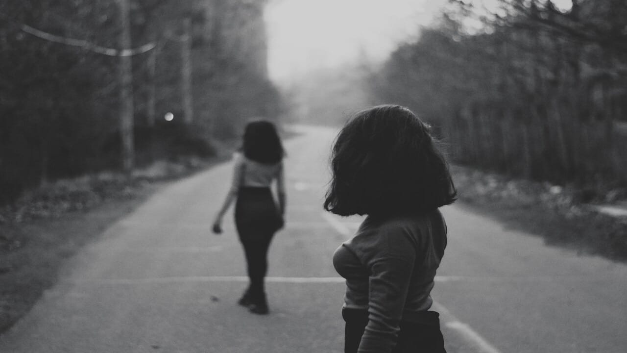 A woman looking at another woman