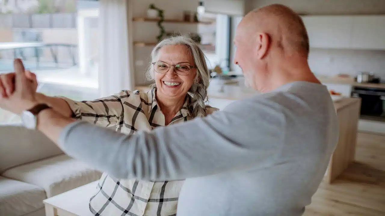 A couple dancing at home