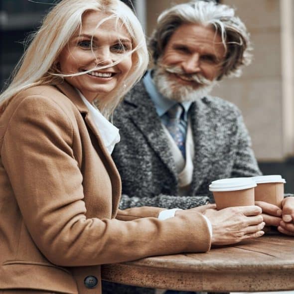 A mature couple having coffee together