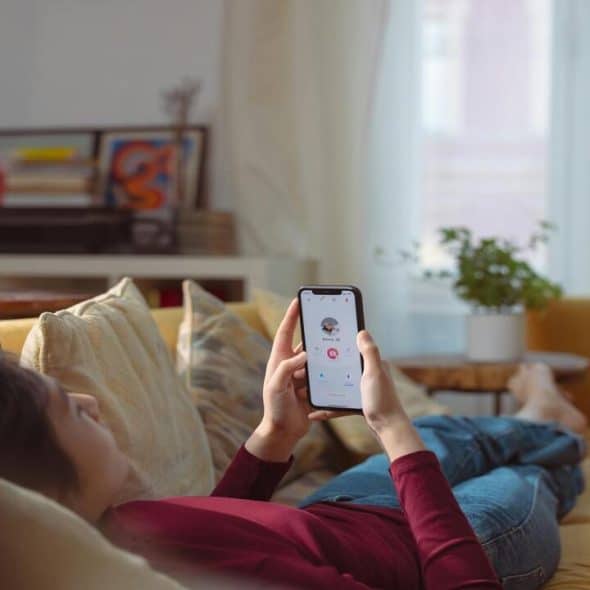 A woman swiping through a dating app