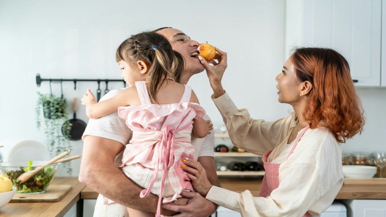 A couple spending time with their daughter