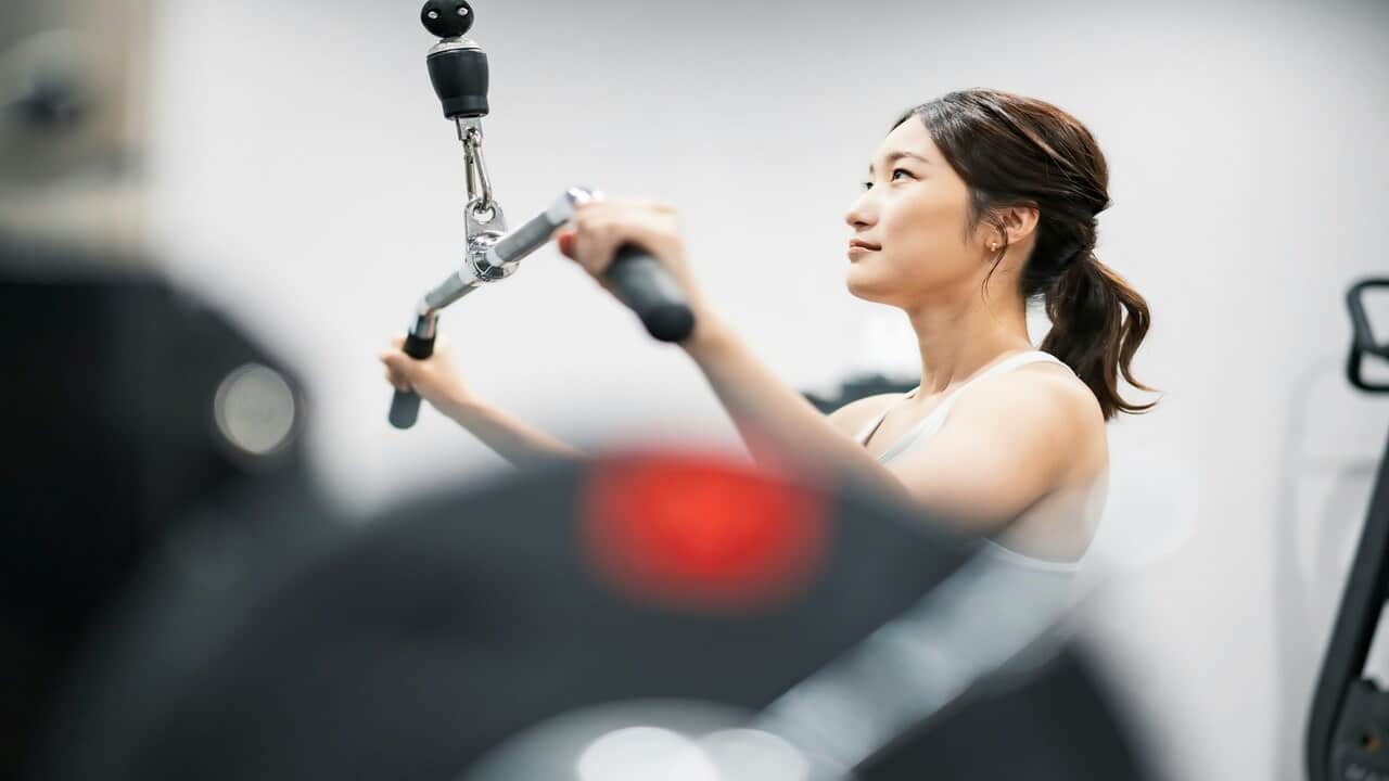 A woman exercising in the gym