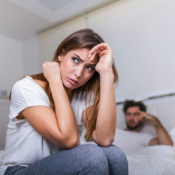 A man being silent behind the woman
