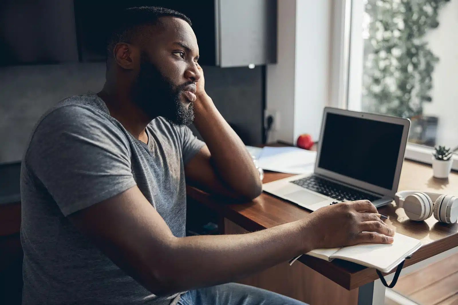 thoughtful man neutral background